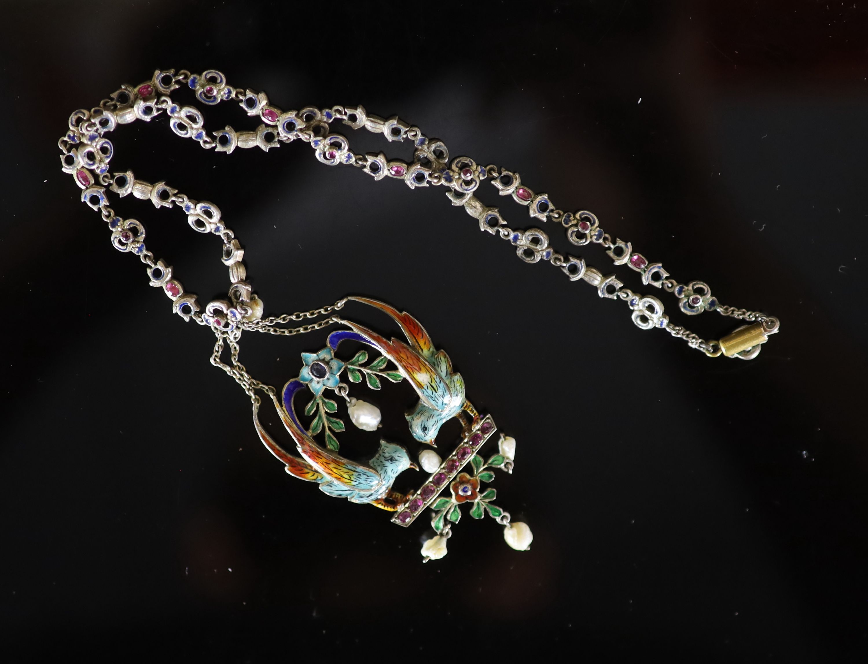 A 19th century Austro-Hungarian? silver gilt, gem, baroque pearl and polychrome enamel set drop pendant necklace